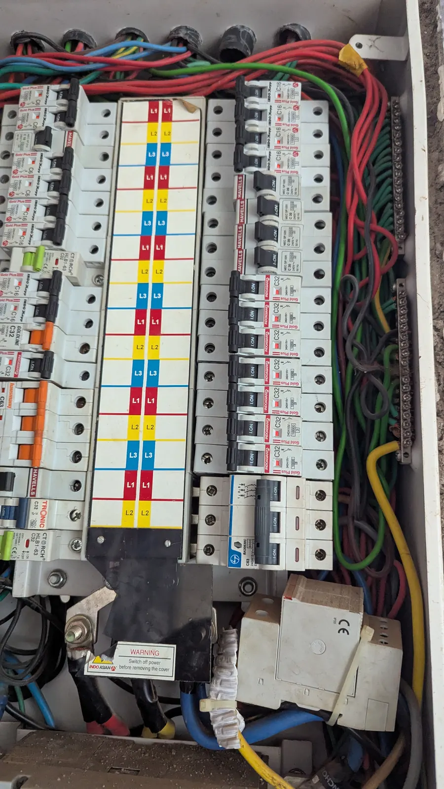 Rows of circuit breakers and labeled wiring inside an open load center